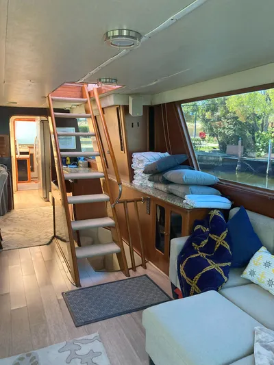 Raiders Yacht Photos Pics Interior of 1988 Viking 70 Cockpit Motor Yacht with stairs and seating area.