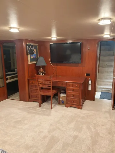 Raiders Yacht Photos Pics Interior of 1988 Viking 70 Cockpit Motor Yacht with desk and TV