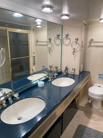 Raiders Yacht Photos Pics 1988 Viking 70 Cockpit Motor Yacht bathroom with double sinks and shower.