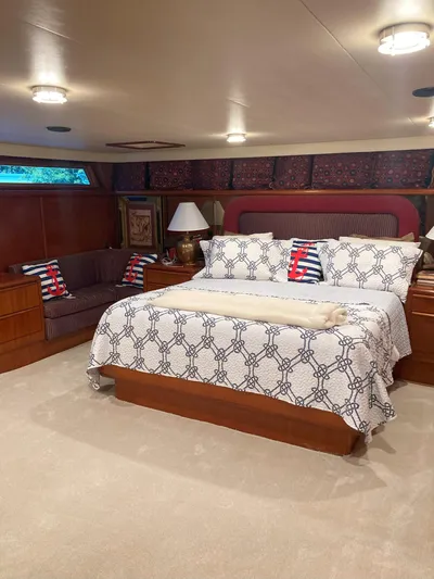 Raiders Yacht Photos Pics Luxurious bedroom in a 1988 Viking 70 Cockpit Motor Yacht with elegant decor.