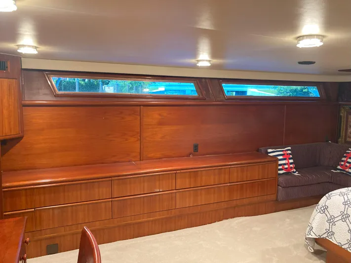 Raiders Yacht Photos Pics Interior of 1988 Viking 70 Cockpit Motor Yacht with wooden cabinetry and seating.