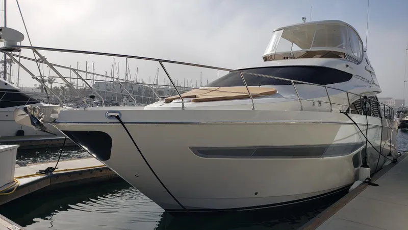 Happy Ours Yacht Photos Pics Luxury 2007 Marquis 55 LS yacht docked at marina, showcasing sleek design and spacious deck.