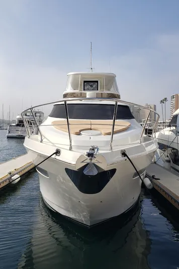 Happy Ours Yacht Photos Pics 2007 Marquis 55 LS yacht docked at marina, front view.