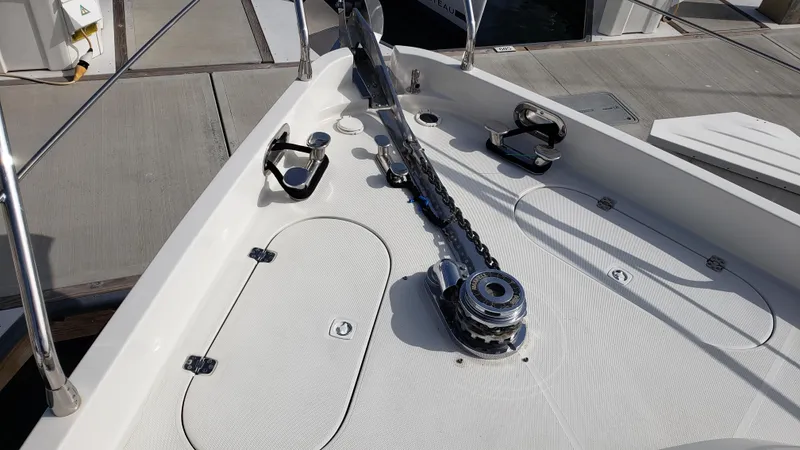 Happy Ours Yacht Photos Pics Deck of 2007 Marquis 55 LS yacht with anchor chain and fittings.