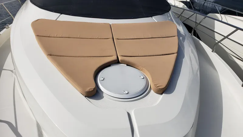 Happy Ours Yacht Photos Pics 2007 Marquis 55 LS yacht with tan cushions on deck.