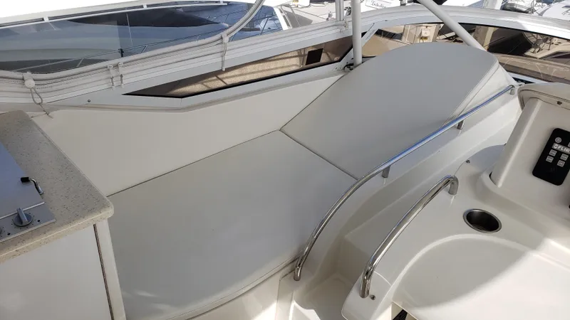 Happy Ours Yacht Photos Pics 2007 Marquis 55 LS yacht interior with sleek seating and modern design.