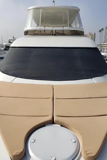 Happy Ours Yacht Photos Pics 2007 Marquis 55 LS yacht with beige sun pads and sleek design.