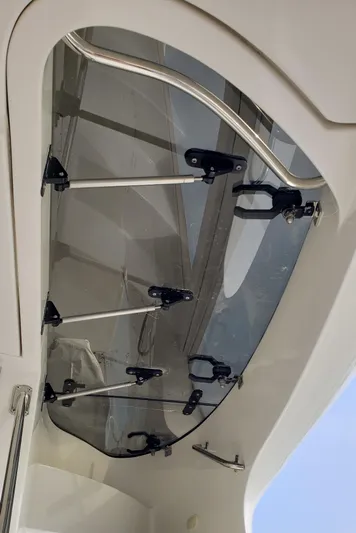 Happy Ours Yacht Photos Pics 2007 Marquis 55 LS yacht canopy with sleek metal and glass design.