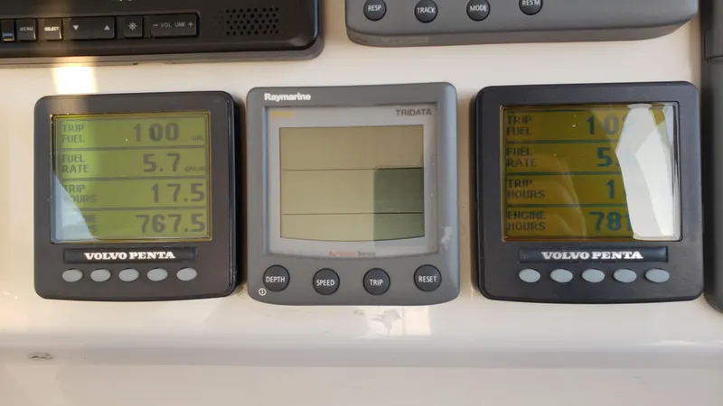 Happy Ours Yacht Photos Pics Control panel of a 2007 Marquis 55 LS yacht with Volvo Penta displays.