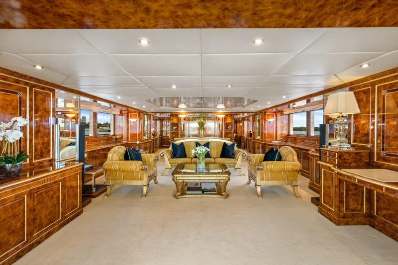 Mistress Yacht Photos Pics Luxurious interior of 1991 Benetti 46m yacht with elegant furnishings and wood paneling.