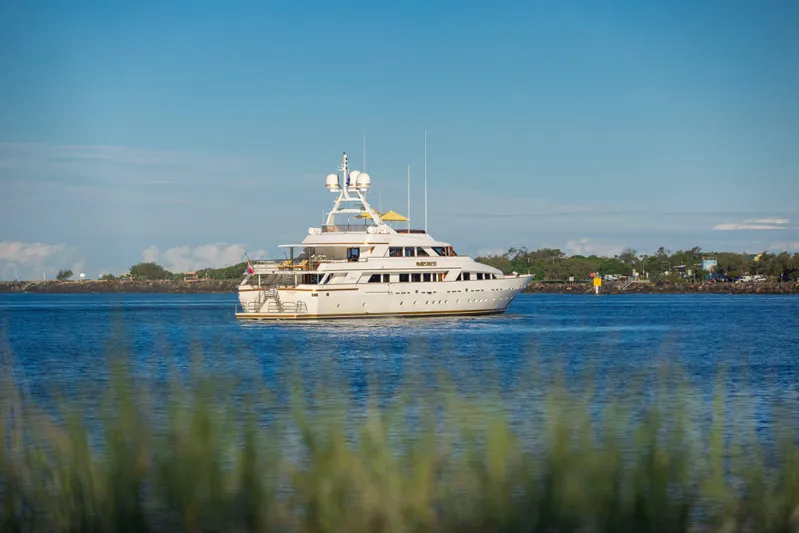 Mistress Yacht Photos Pics Luxury Benetti 46m yacht from 1991 cruising on a serene blue sea.