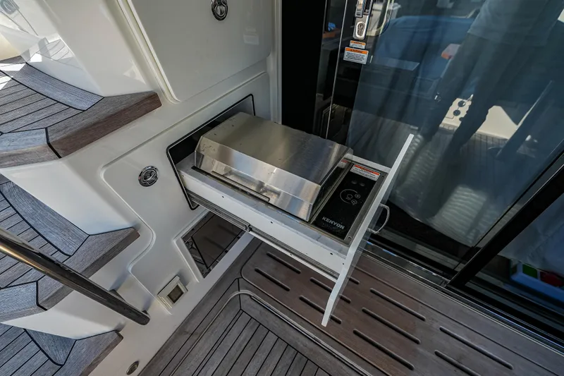 Yan Ge Yacht Photos Pics Outdoor grill on 2018 Sea Ray L590 Fly yacht deck, featuring Kenyon electric grill.