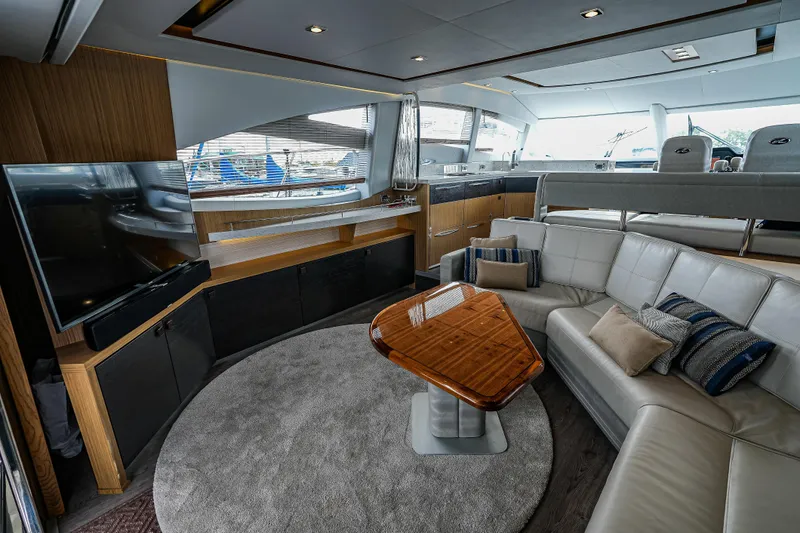 Yan Ge Yacht Photos Pics Luxurious interior of 2018 Sea Ray L590 Fly yacht with modern furnishings and entertainment system.