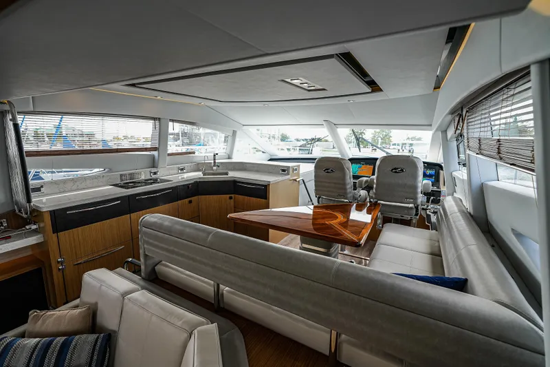 Yan Ge Yacht Photos Pics Luxurious interior of 2018 Sea Ray L590 Fly yacht with modern seating and helm.