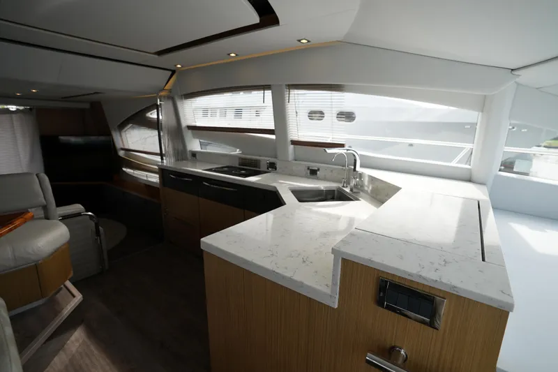 Yan Ge Yacht Photos Pics Luxurious interior of 2018 Sea Ray L590 Fly yacht with modern kitchen design.