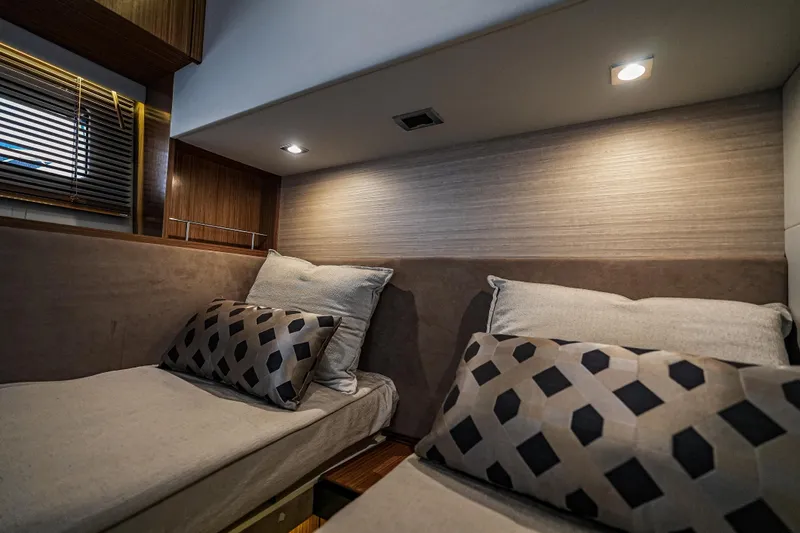 Yan Ge Yacht Photos Pics Luxurious cabin interior of 2018 Sea Ray L590 Fly yacht with modern bedding and lighting.