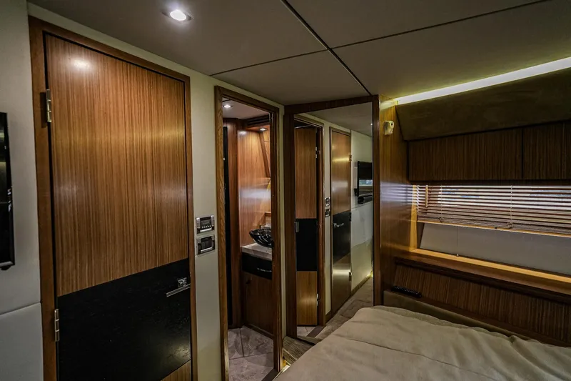 Yan Ge Yacht Photos Pics Luxurious interior of 2018 Sea Ray L590 Fly yacht cabin with wood finishes.