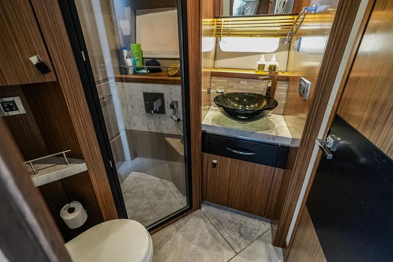 Yan Ge Yacht Photos Pics Luxurious bathroom in 2018 Sea Ray L590 Fly yacht with modern fixtures and elegant design.