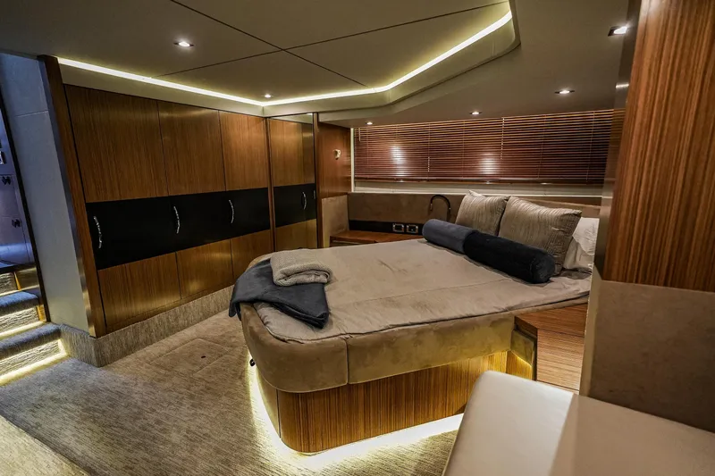 Yan Ge Yacht Photos Pics Luxurious 2018 Sea Ray L590 Fly yacht bedroom with modern wood finishes and ambient lighting.
