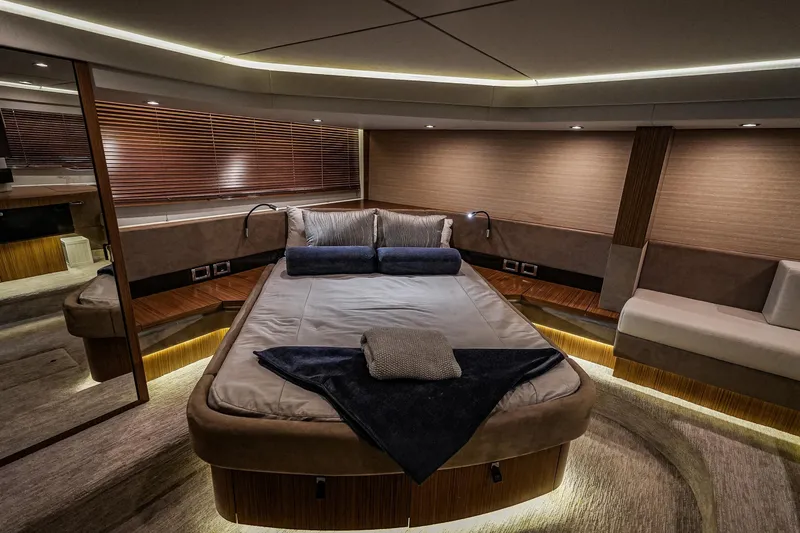 Yan Ge Yacht Photos Pics Luxurious bedroom interior of 2018 Sea Ray L590 Fly yacht with modern design and ambient lighting.