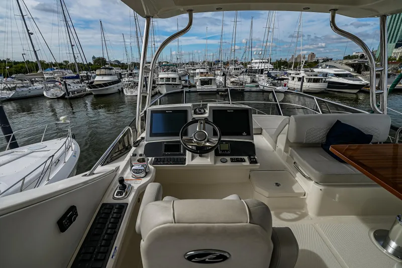 Yan Ge Yacht Photos Pics Flybridge view of 2018 Sea Ray L590 Fly yacht docked in a marina.