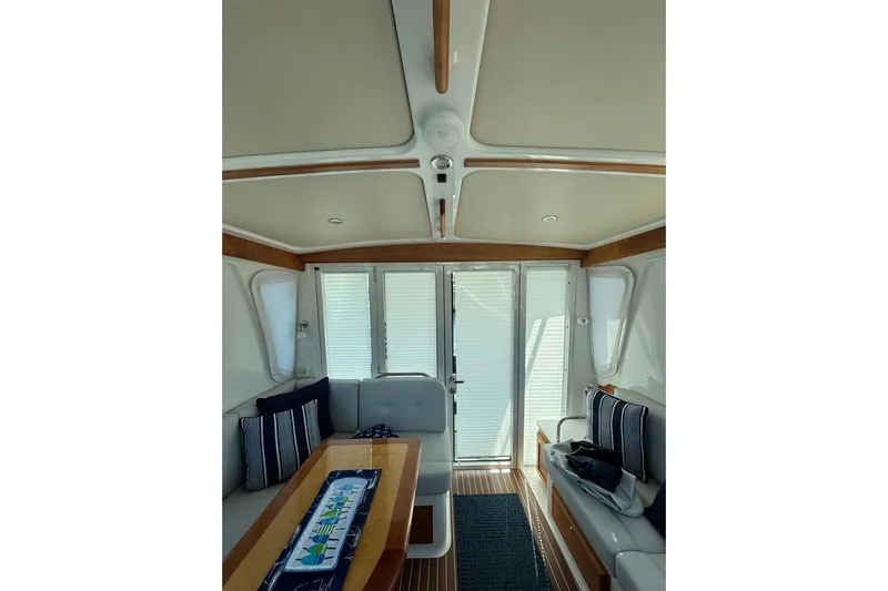 Luna Yacht Photos Pics Interior of 2020 Back Cove 37 yacht with elegant seating and wooden accents.