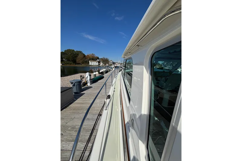 Luna Yacht Photos Pics 2020 Back Cove 37 yacht docked, showcasing sleek design and waterfront view.