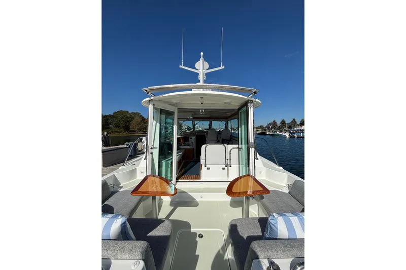 Luna Yacht Photos Pics 2020 Back Cove 37 boat interior with seating, table, and open cabin view.