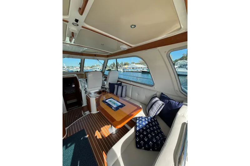 Luna Yacht Photos Pics Luxurious interior of 2020 Back Cove 37 yacht with elegant seating and nautical decor.