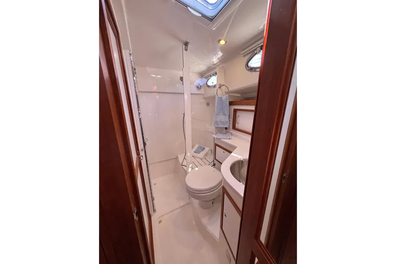 Luna Yacht Photos Pics 2020 Back Cove 37 yacht bathroom with shower, sink, and toilet.