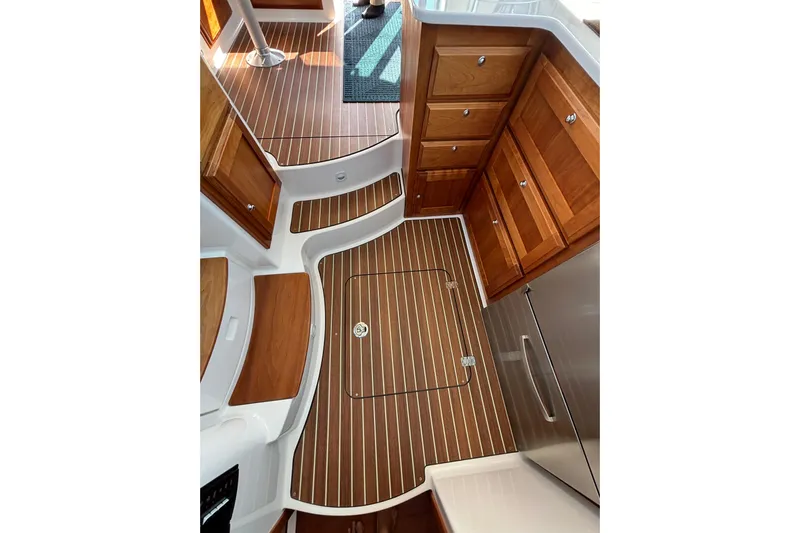 Luna Yacht Photos Pics 2020 Back Cove 37 interior with wood cabinetry and striped flooring.