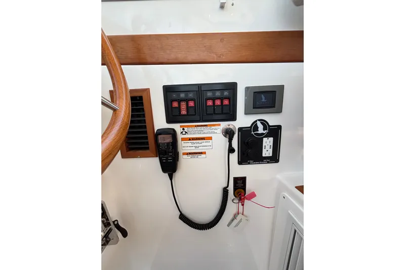 Luna Yacht Photos Pics Control panel of 2020 Back Cove 37 boat with switches and communication equipment.