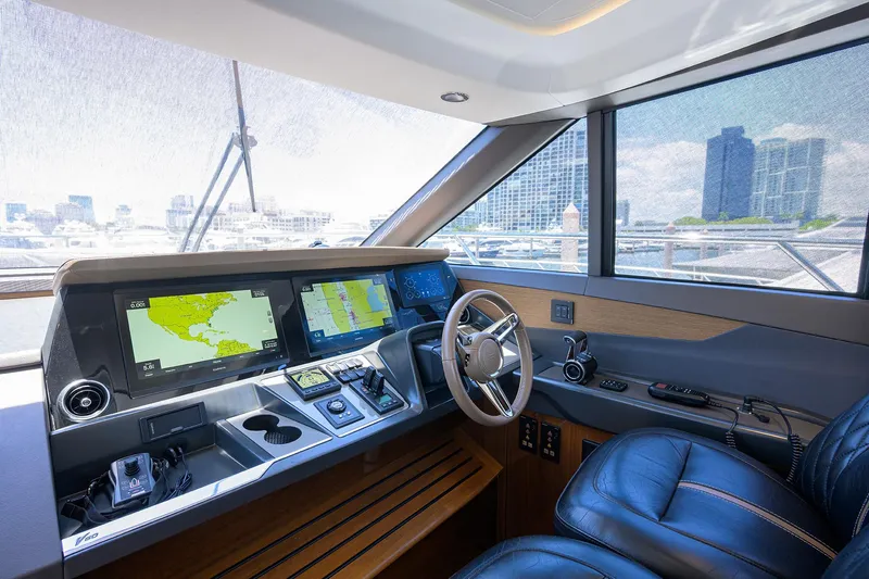 Haute Vie Yacht Photos Pics Luxurious 2020 Princess V60 yacht cockpit with advanced navigation systems and leather seating.