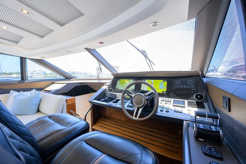 Haute Vie Yacht Photos Pics Luxurious 2020 Princess V60 yacht interior with modern helm and plush seating.