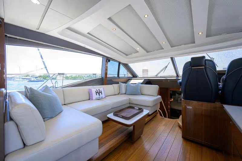 Haute Vie Yacht Photos Pics Luxurious interior of 2020 Princess V60 yacht with elegant seating and modern design.