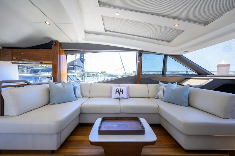 Haute Vie Yacht Photos Pics Luxurious interior of 2020 Princess V60 yacht with elegant white seating and modern design.