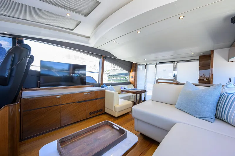 Haute Vie Yacht Photos Pics Luxurious interior of 2020 Princess V60 yacht with modern furnishings and large windows.