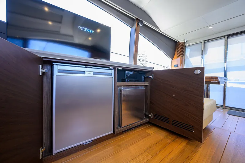 Haute Vie Yacht Photos Pics Luxurious interior of 2020 Princess V60 yacht with modern appliances and wood finish.