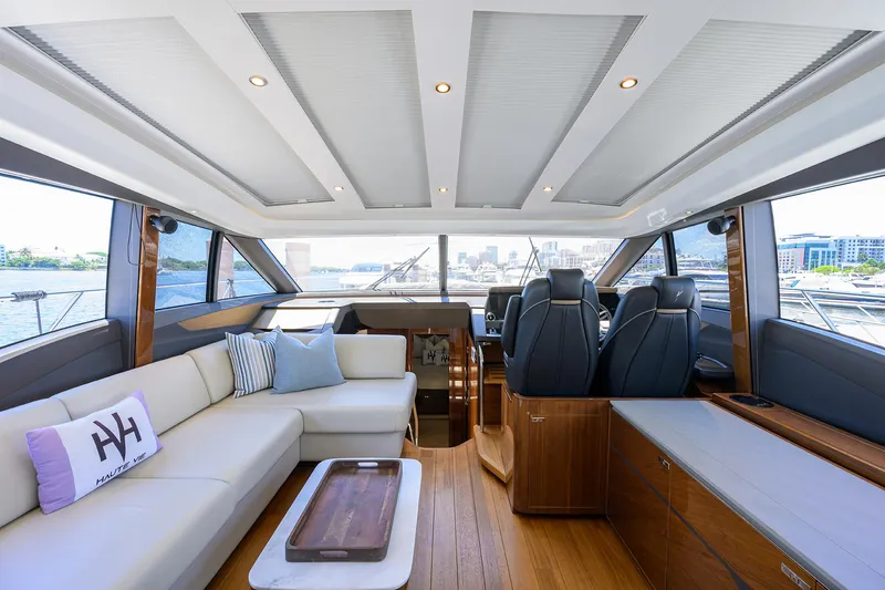 Haute Vie Yacht Photos Pics Luxurious interior of 2020 Princess V60 yacht with elegant seating and panoramic windows.