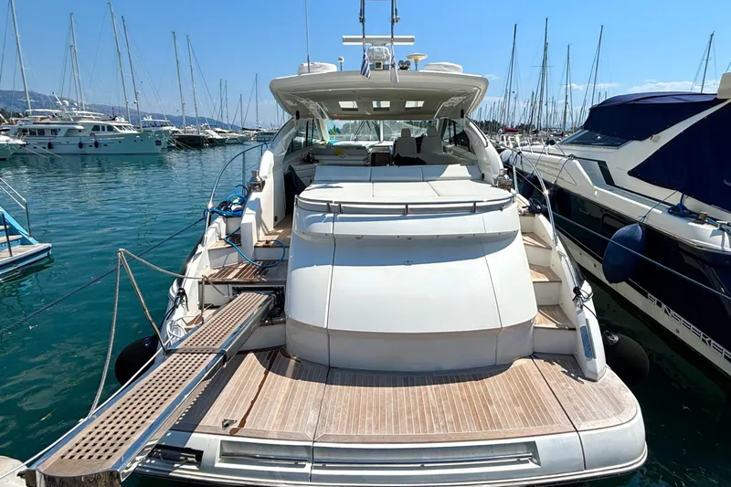  Yacht Photos Pics 2006 Princess V53 yacht docked in a marina, showcasing sleek design and spacious deck.