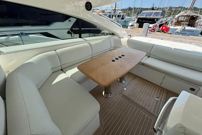  Yacht Photos Pics Luxurious 2006 Princess V53 yacht interior with elegant seating and wooden table.