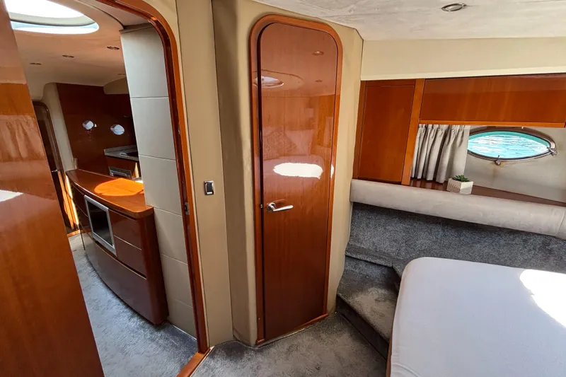  Yacht Photos Pics Interior of 2006 Princess V53 yacht, featuring wood finishes and modern amenities.
