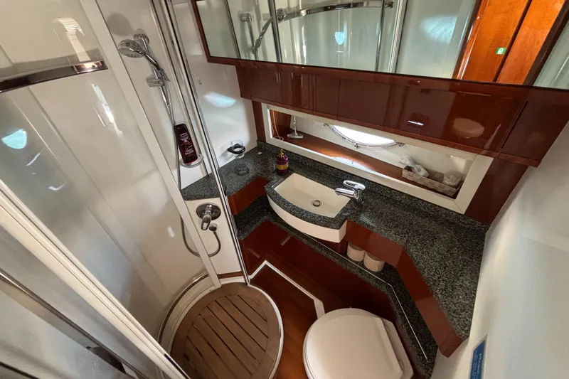  Yacht Photos Pics Luxurious bathroom in 2006 Princess V53 yacht with modern fixtures and elegant design.