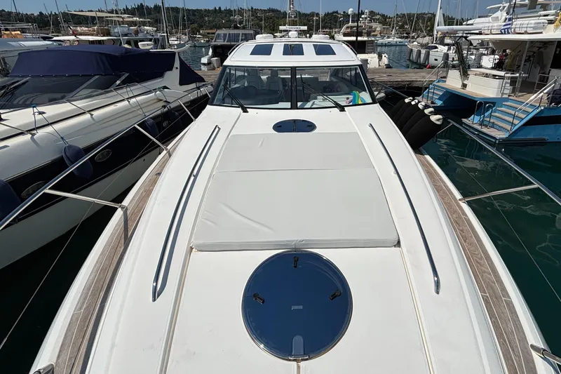  Yacht Photos Pics 2006 Princess V53 yacht docked at marina, showcasing sleek design and spacious deck.