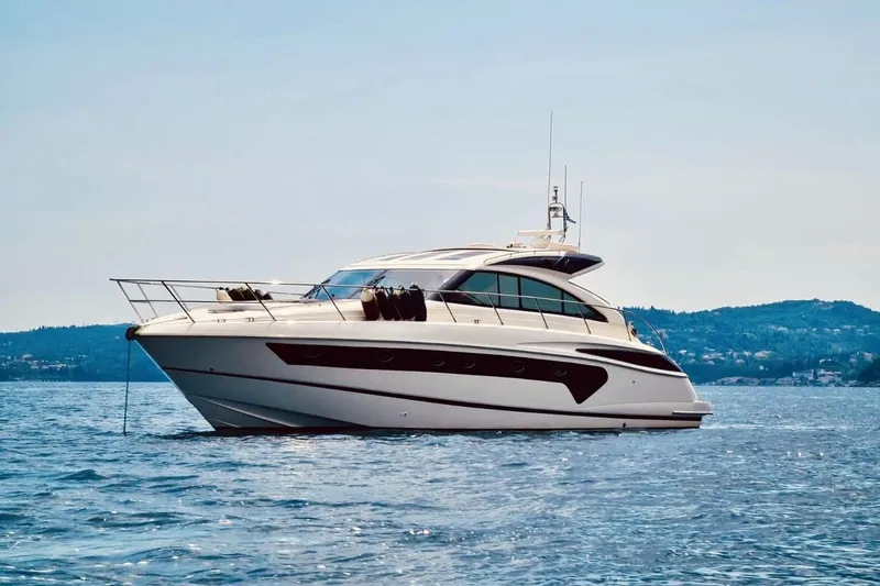  Yacht Photos Pics 2006 Princess V53 yacht on calm water with scenic background.