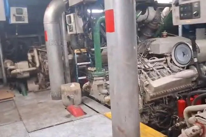  Yacht Photos Pics Industrial engine room with custom machinery and piping, featuring a large engine and control panels.