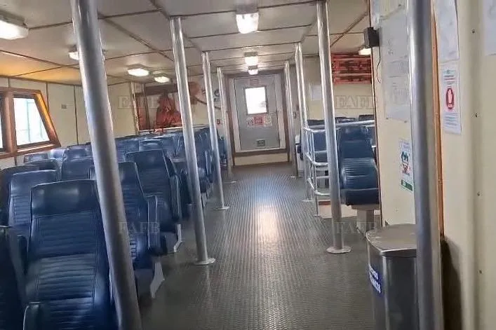  Yacht Photos Pics Interior of a passenger ferry with blue seats and metal poles, 2009 custom model.