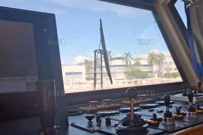  Yacht Photos Pics Control panel inside a custom 2009 vehicle, overlooking a sunny coastal view.