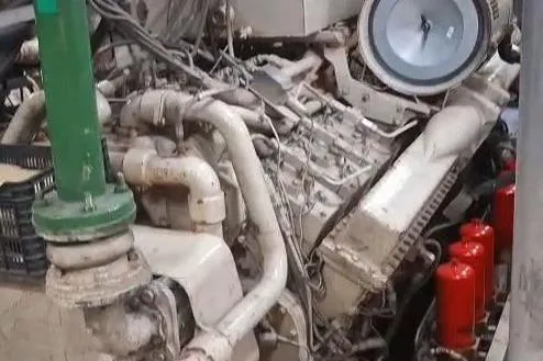  Yacht Photos Pics Custom 2009 engine with complex piping and red components in an industrial setting.