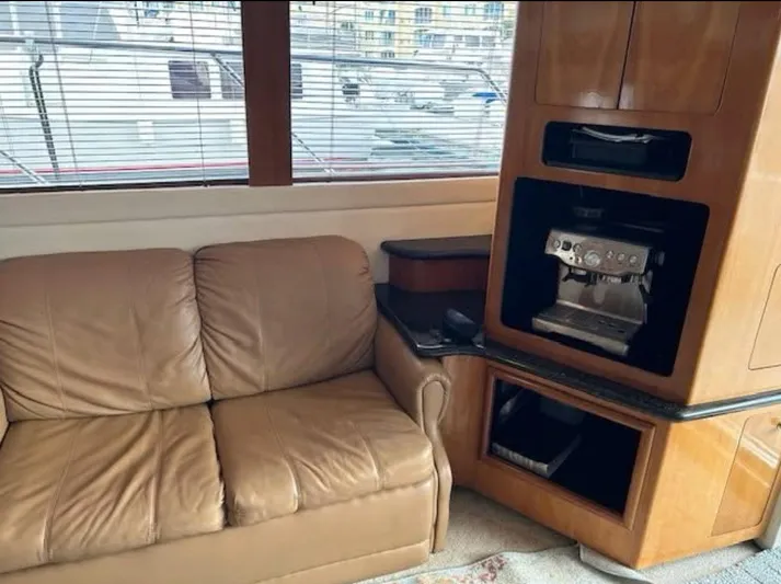  Yacht Photos Pics Interior of 2000 Carver 450 Voyager Pilothouse with leather sofa and built-in coffee machine.
